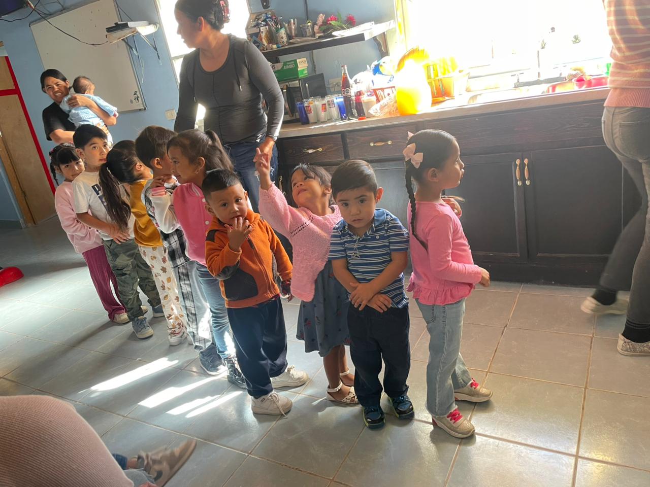 toddlers standing in line for snacks
